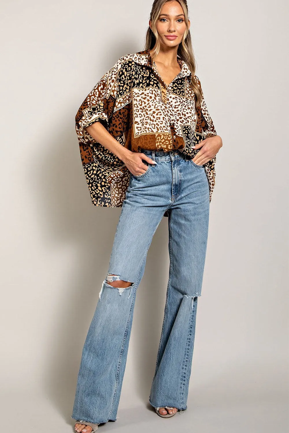 Mix animal print button down top with dolman sleeves