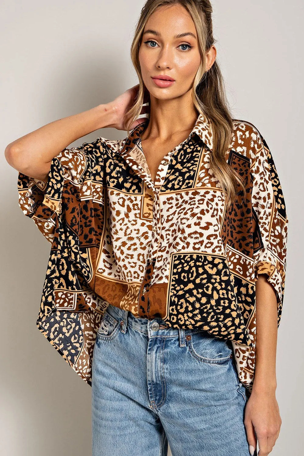 Mix animal print button down top with dolman sleeves