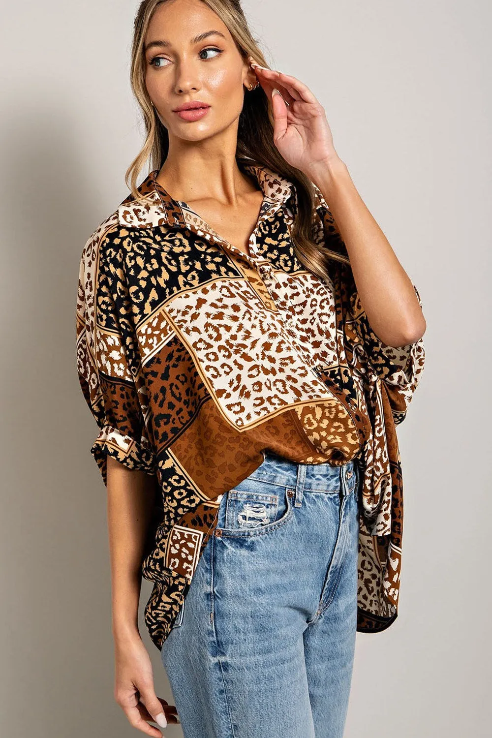 Mix animal print button down top with dolman sleeves