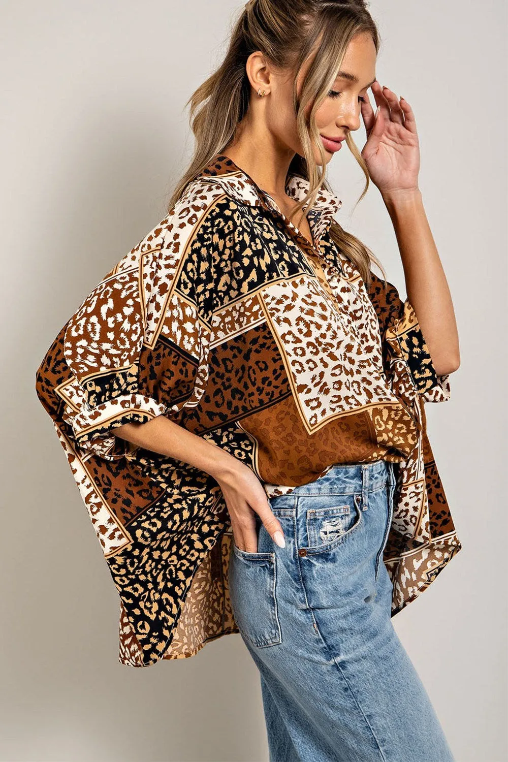 Mix animal print button down top with dolman sleeves